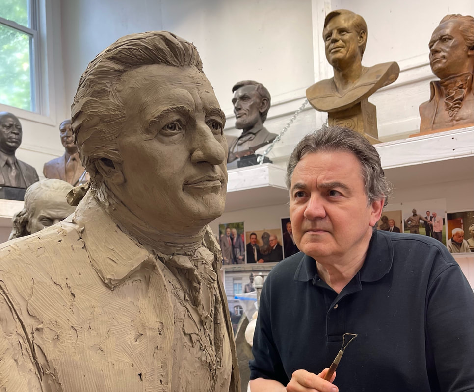 Zenos Frudakis, a world-famous sculptor, peers at his work on Thomas Paine’s face.
