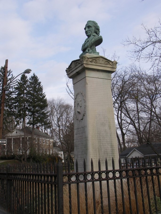 Paine’s New Rochelle Monument is a 12-foot marble column marking his original burial site. Paine’s New Rochelle Monument is a 12-foot marble column marking his original burial site. In 1837, Gilbert Vale, editor of the New York Beacon, started a subscription for the purpose of erecting a monument that was dedicated on May 30th, 1881. Sculptor William Macdonald created the bronze bust that was placed upon the monument on May 30th, 1899 – Flickr