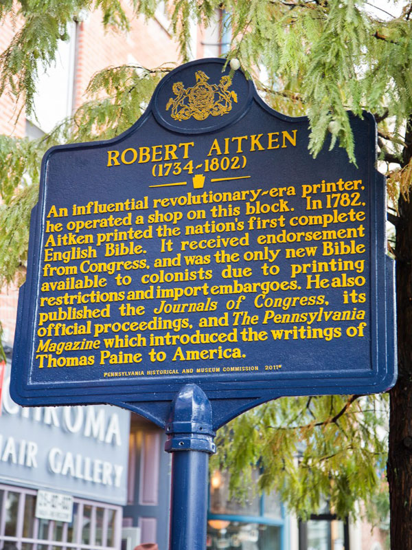 Marker in Philadelphia, Pennsylvania indicating the location of Robert Aitken's printshop with the inscription reading in part, Aitken 'published the Journals of Congress, its official proceedings, and The Pennsylvania Magazine which introduced the writings of Thomas Paine to America'. Erected in 2012 - Pennsylvania Historical and Museum Commission