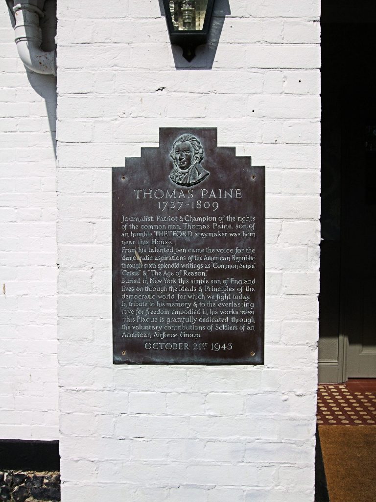 This plaque is attached to the wall of the Thomas Paine Hotel in Thetford, England. The plaque is dated October 21st, 1943 and was erected during World War II through the 'voluntary contributions of soldiers of an American Airforce Group' - Photo by Jim Linwood