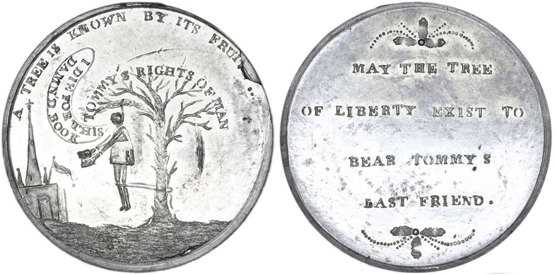 A 1793 tin medal with Thomas Paine hanging from a tree holding a book, church to left. ‘Tommy’s Rights of Man’ is inscribed above the tree with Paine saying ‘I died for this damn’d book’. The reverse side says ‘May the tree of liberty exist to bear Tommy’s last friend’ – © The Trustees of the British Museum