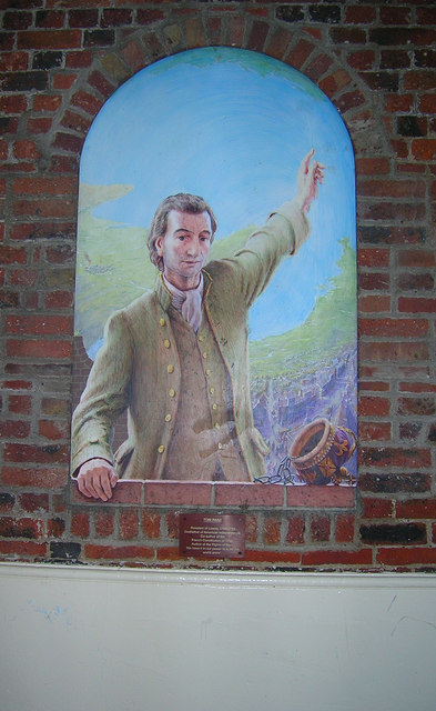 A 1994 mural of Thomas Paine painted in by Julian Bell that stands in the passage that runs through the old Market Tower from Market Lane to Market Street in Lewes, UK. Paine lived in Lewes between 1768 to 1774 – Photo by Simon Carey